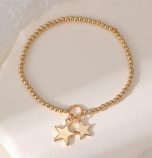 Bracelet: Stretch Beads Large and Small Star Charms - Gold