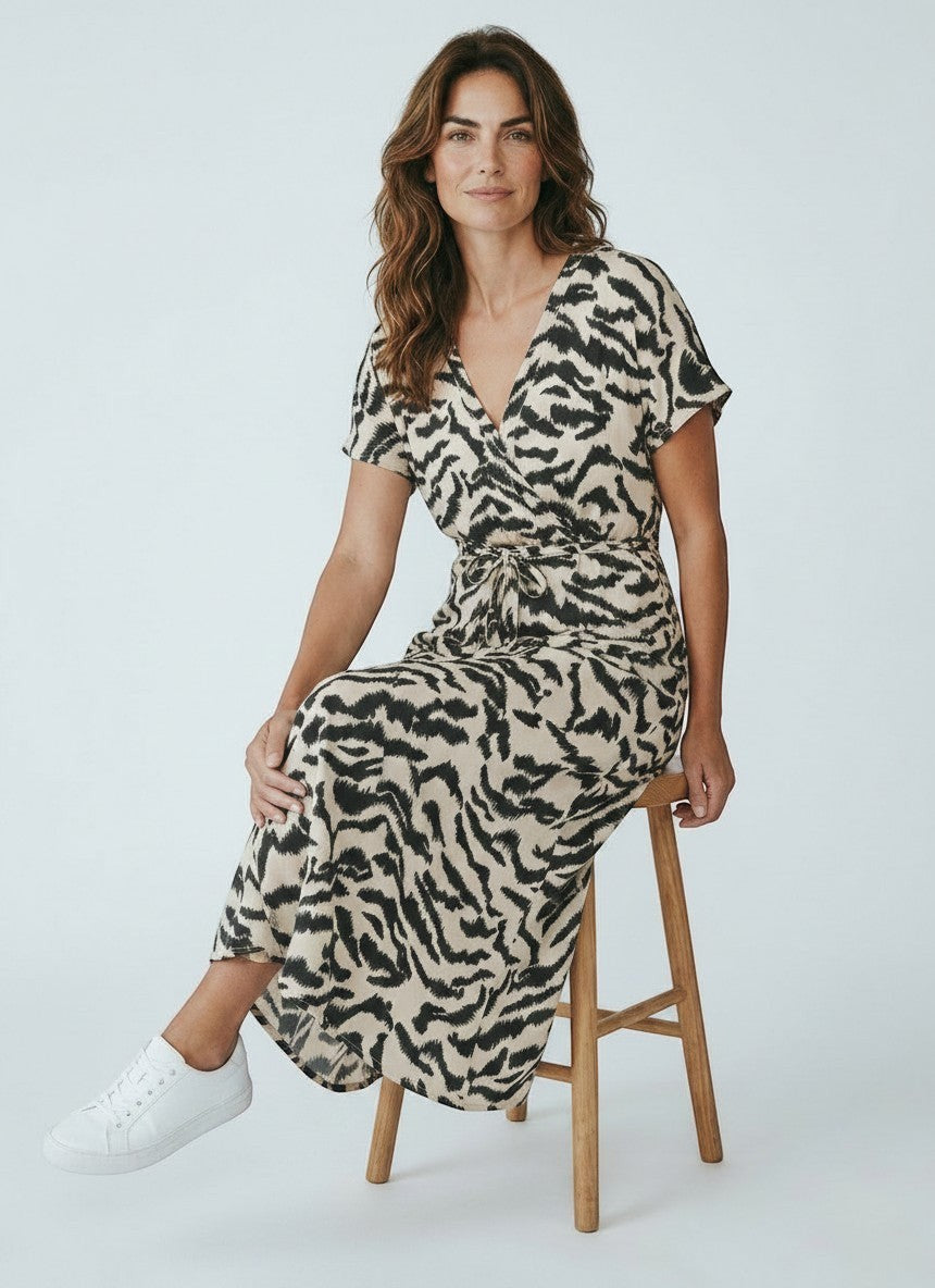 Antique Rose Boutique midi kaftan dress in cream and black abstract animal print with V-neck and front knot detail
