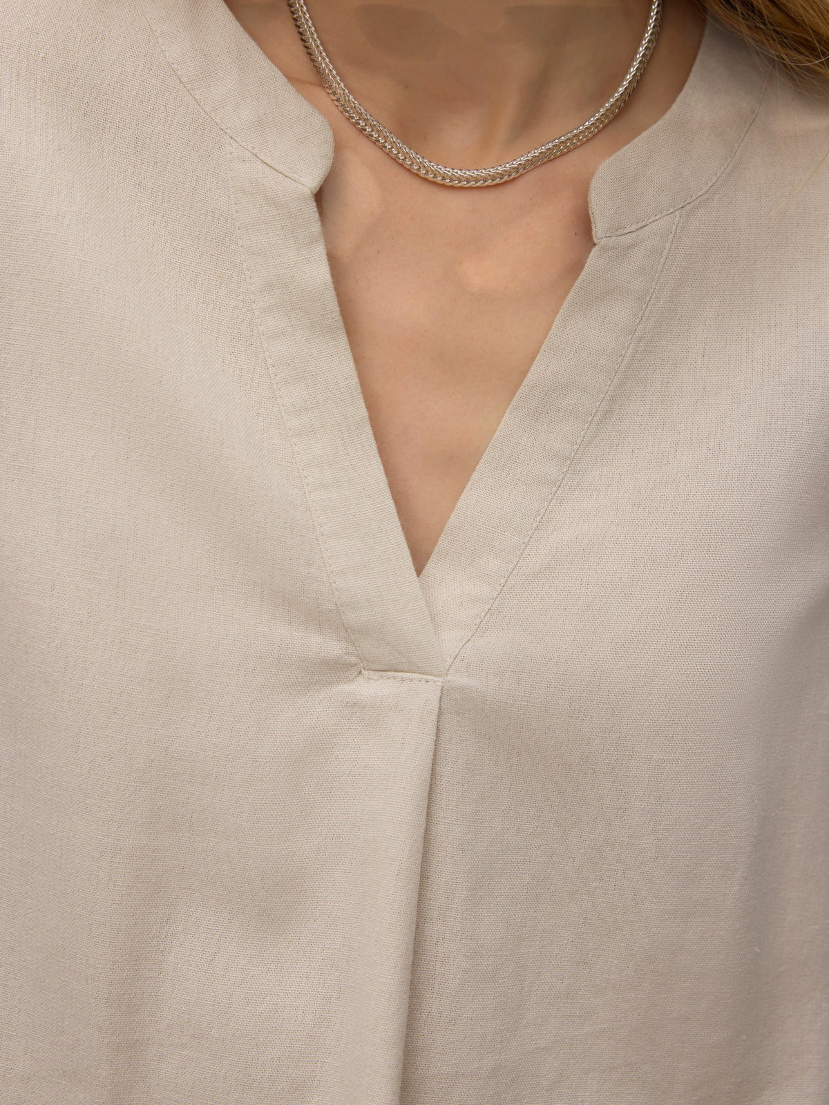 Antique Rose Boutique beige linen mix V-neck blouse with short sleeves and a subtle front pleat detail