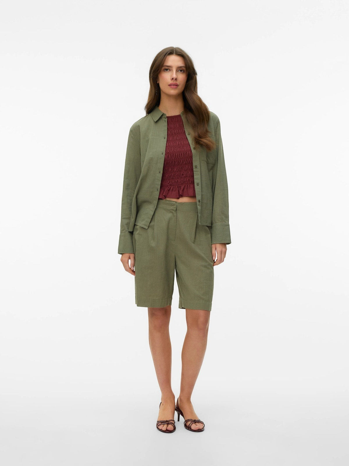 Antique Rose Boutique Bermuda CAIA shorts in deep lichen green cotton and linen blend with side pockets.