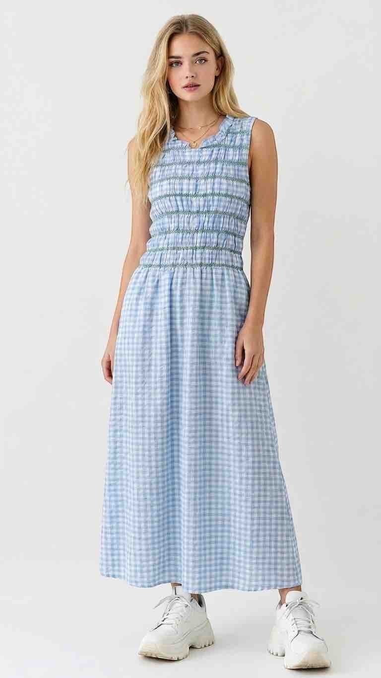Antique Rose Boutique sleeveless light blue gingham maxi dress with a smocked bodice worn by a blonde model.