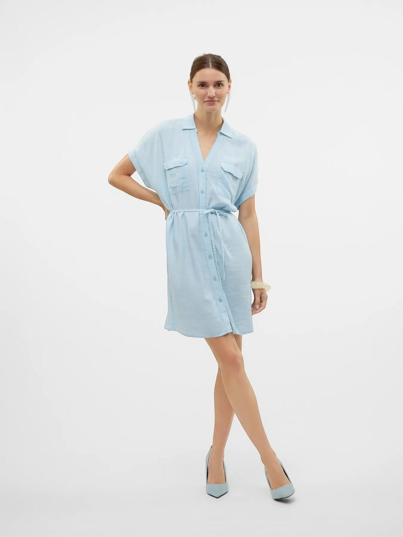 Antique Rose Boutique airy blue linen-mix shirt dress with V-neck, chest pockets, and waist belt on a model