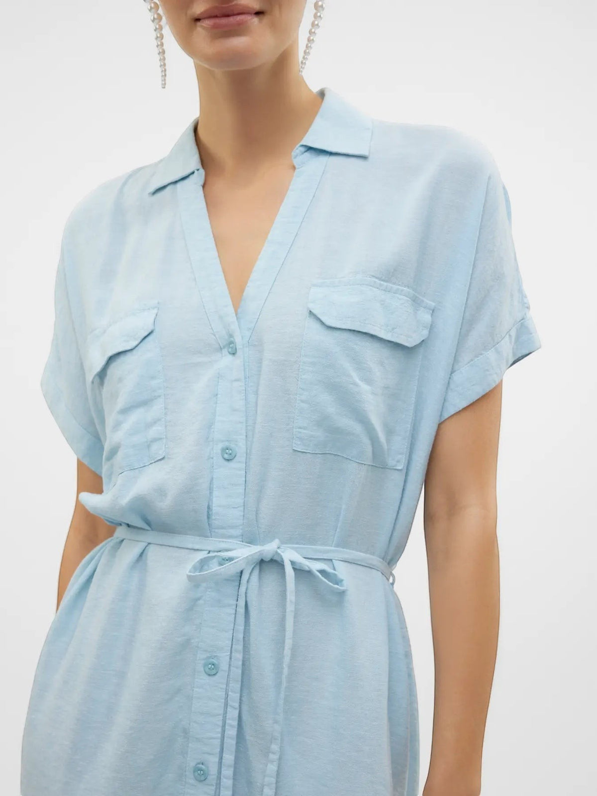 Antique Rose Boutique airy blue linen-mix shirt dress with V-neck, short sleeves, chest pockets, and waist tie belt.