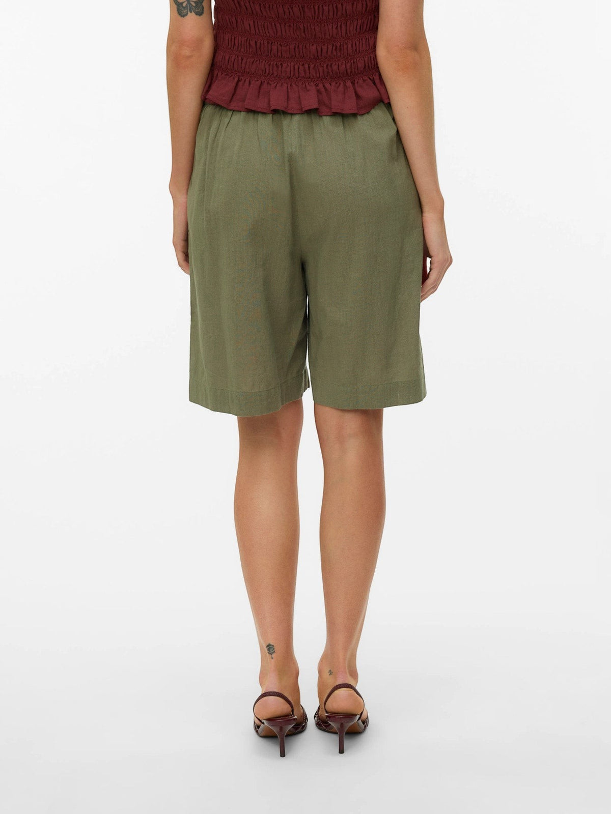 Antique Rose Boutique Vero Moda Bermuda shorts in deep lichen green cotton and linen blend, back view on model