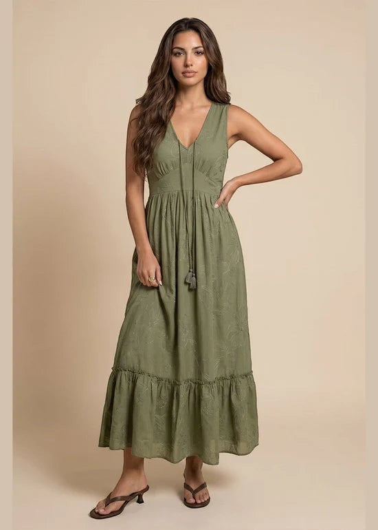 Antique Rose Boutique khaki maxi dress with intricate embroidery, V-neckline, and tassel details on a model