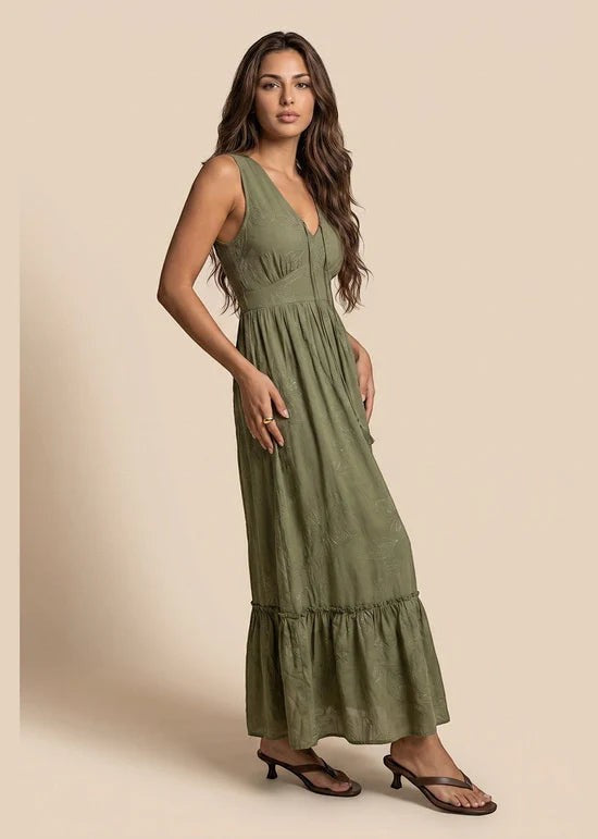 Antique Rose Boutique khaki maxi dress with delicate embroidery and tassel details on a model