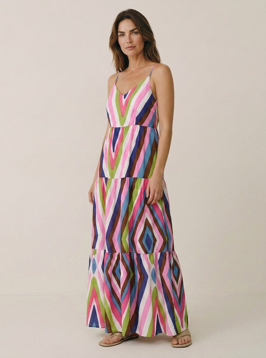 Antique Rose Boutique multicolour striped maxi dress with V-neck, thin straps, and tiered skirt on a model