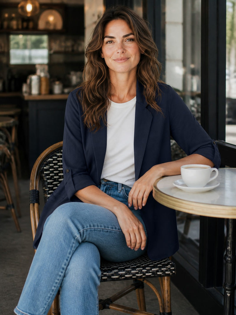 Antique Rose Boutique navy blue LENZING ECOVERO 3/4 sleeve loose blazer worn by a woman sitting at a cafe table