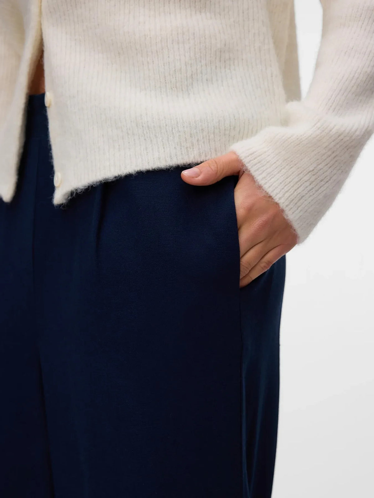 Antique Rose Boutique navy linen mix culotte trousers with side pocket detail, worn with a cream cardigan