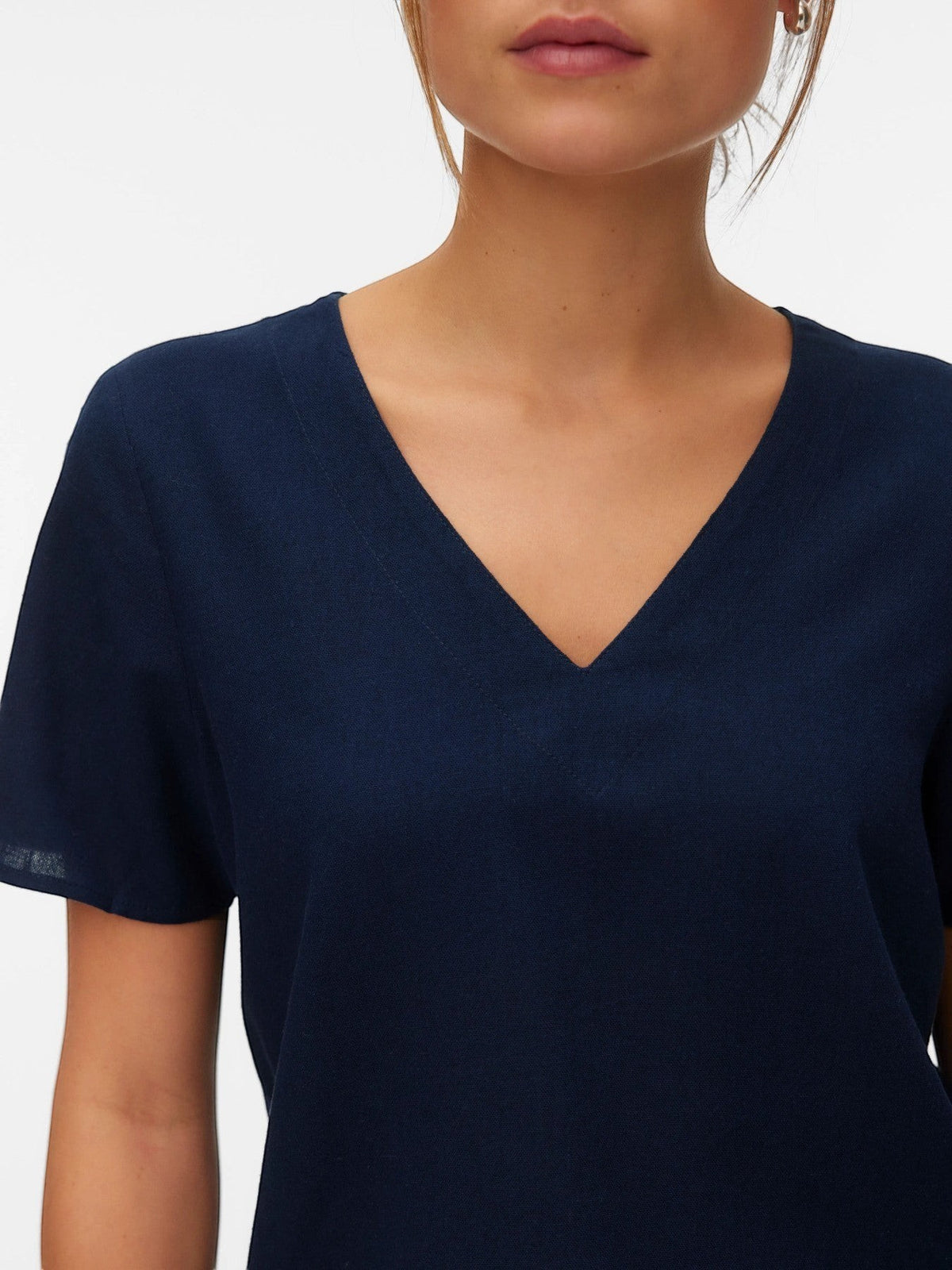 Antique Rose Boutique navy blue V-neck top in a breathable linen-mix fabric with short sleeves and a relaxed fit.
