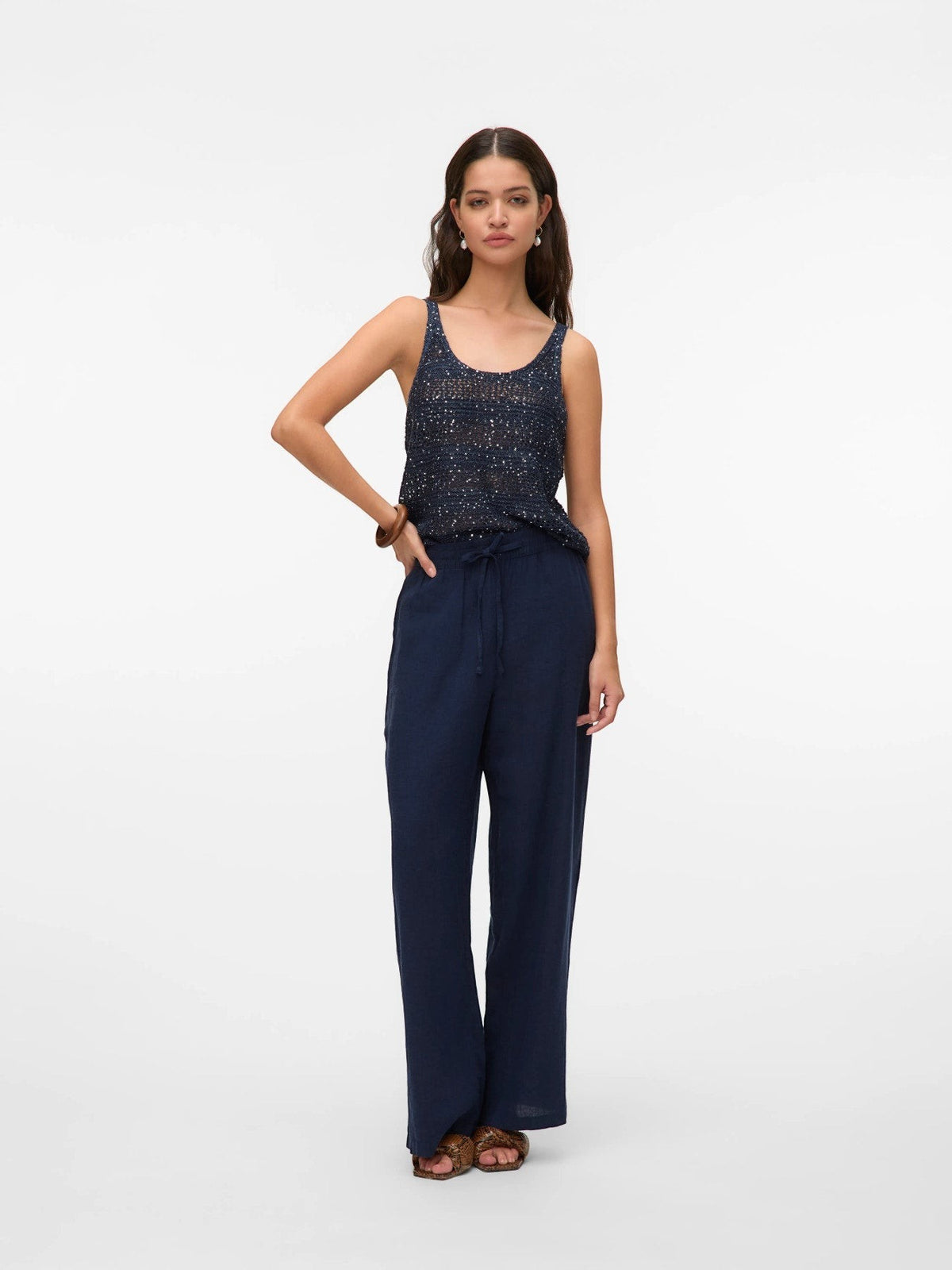 Antique Rose Boutique navy blue wide leg linen mix trousers with elasticated waist and front pockets on a model
