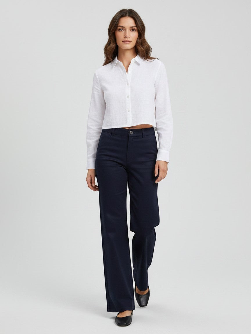 Antique Rose Boutique navy blue high-waisted wide-leg trousers worn by a model with a white cropped shirt