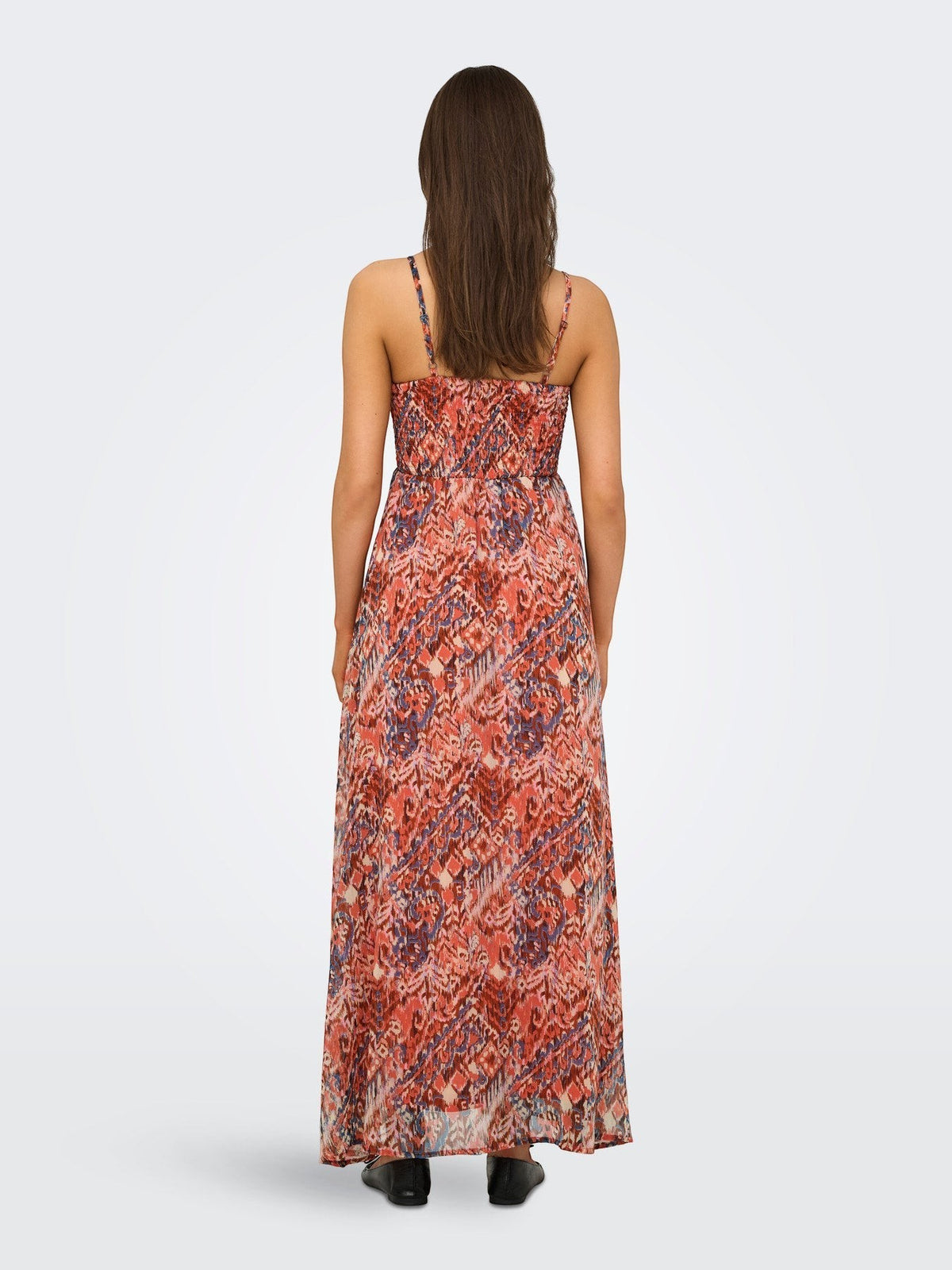 Antique Rose Boutique orange patterned sleeveless maxi dress with V-neck and smock detail, back view.