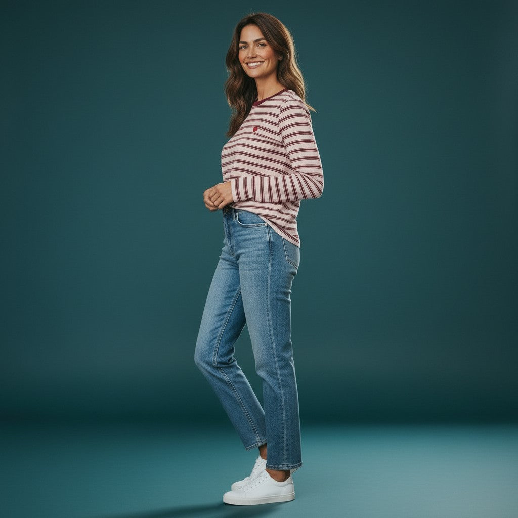Antique Rose Boutique model wearing a chalk pink and burgundy striped organic cotton long sleeve top with heart logo