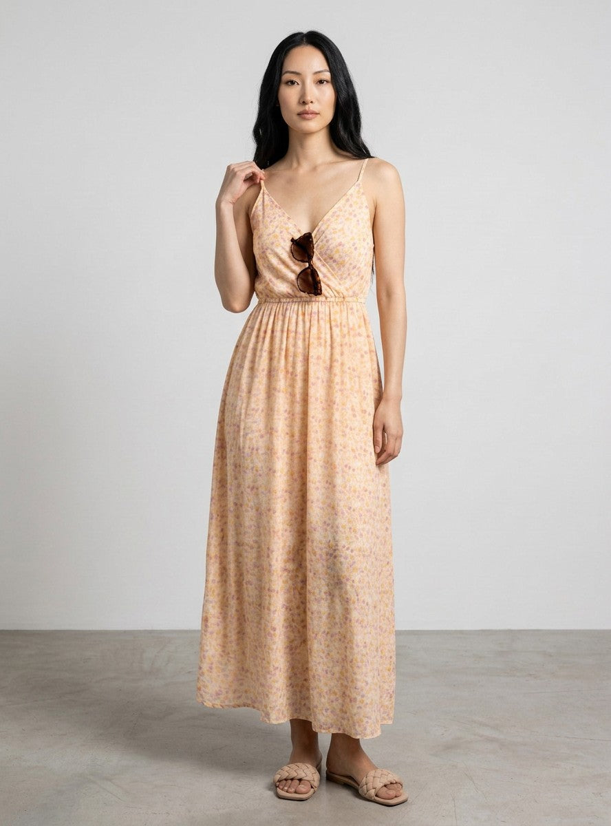 Antique Rose Boutique Vero Moda Smilla maxi dress in white and orange floral print with V-neck on a female model