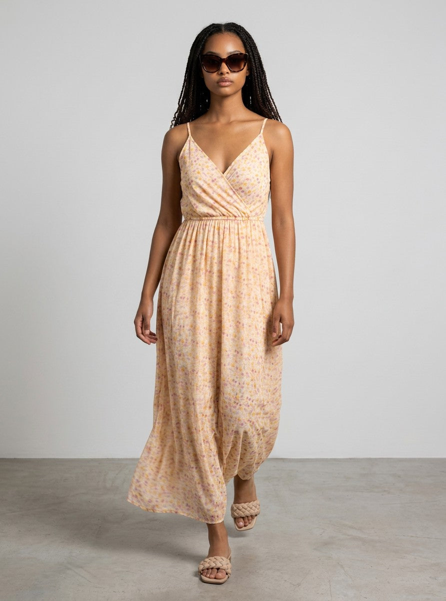 Antique Rose Boutique Vero Moda Smilla maxi dress in white and orange floral print with a V-neck and spaghetti straps.