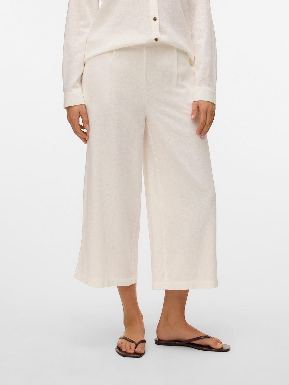 Antique Rose Boutique white linen mix culotte trousers with a high waist and calf-length wide leg fit.