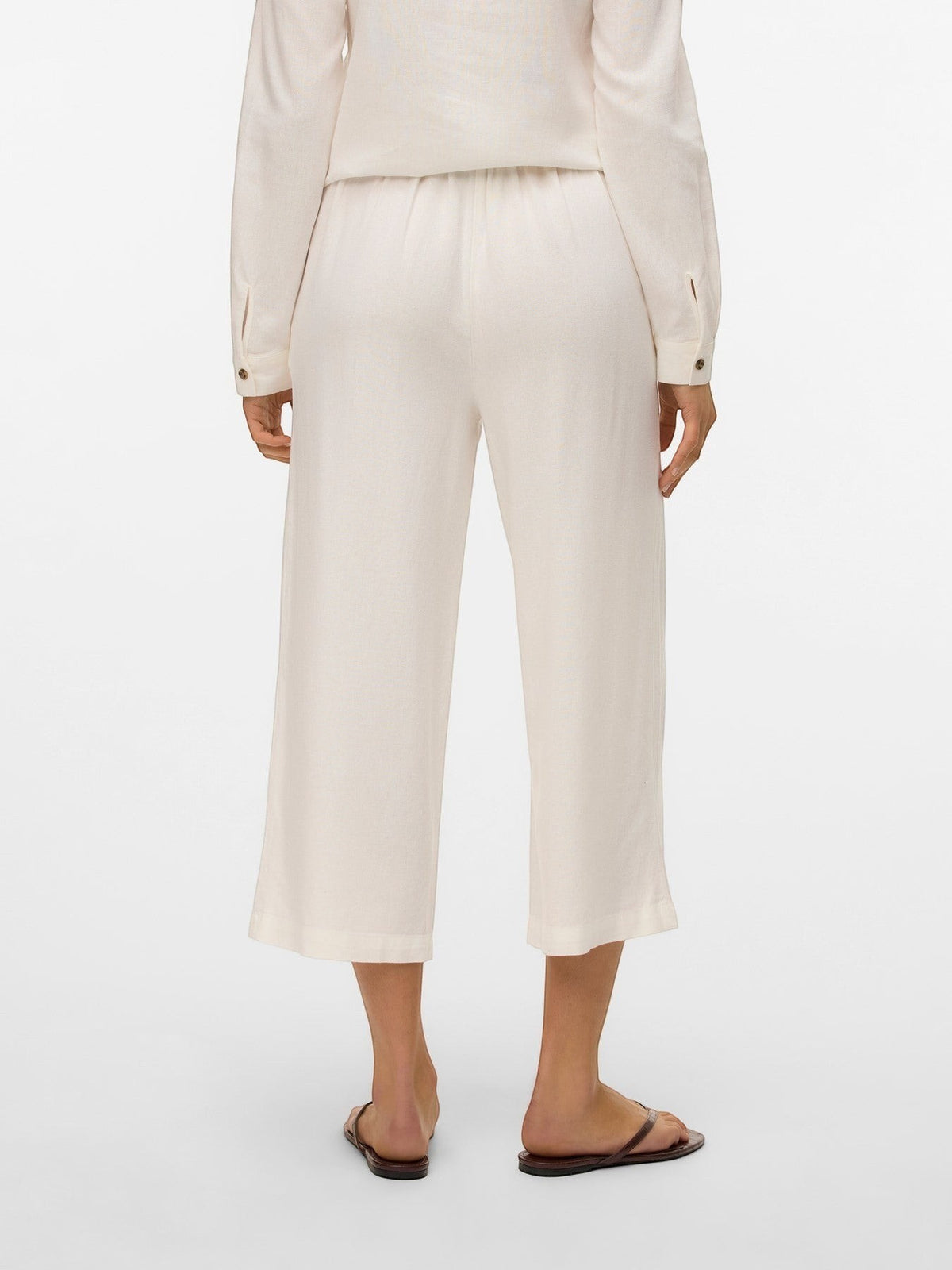 Antique Rose Boutique white linen mix culotte trousers with a high elasticated waist, shown from the back view.