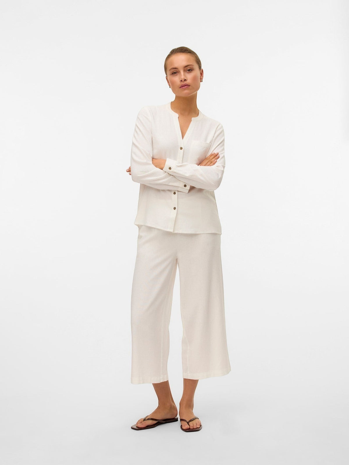 Antique Rose Boutique white linen mix culotte trousers with a high elasticated waist and calf-length wide-leg fit.