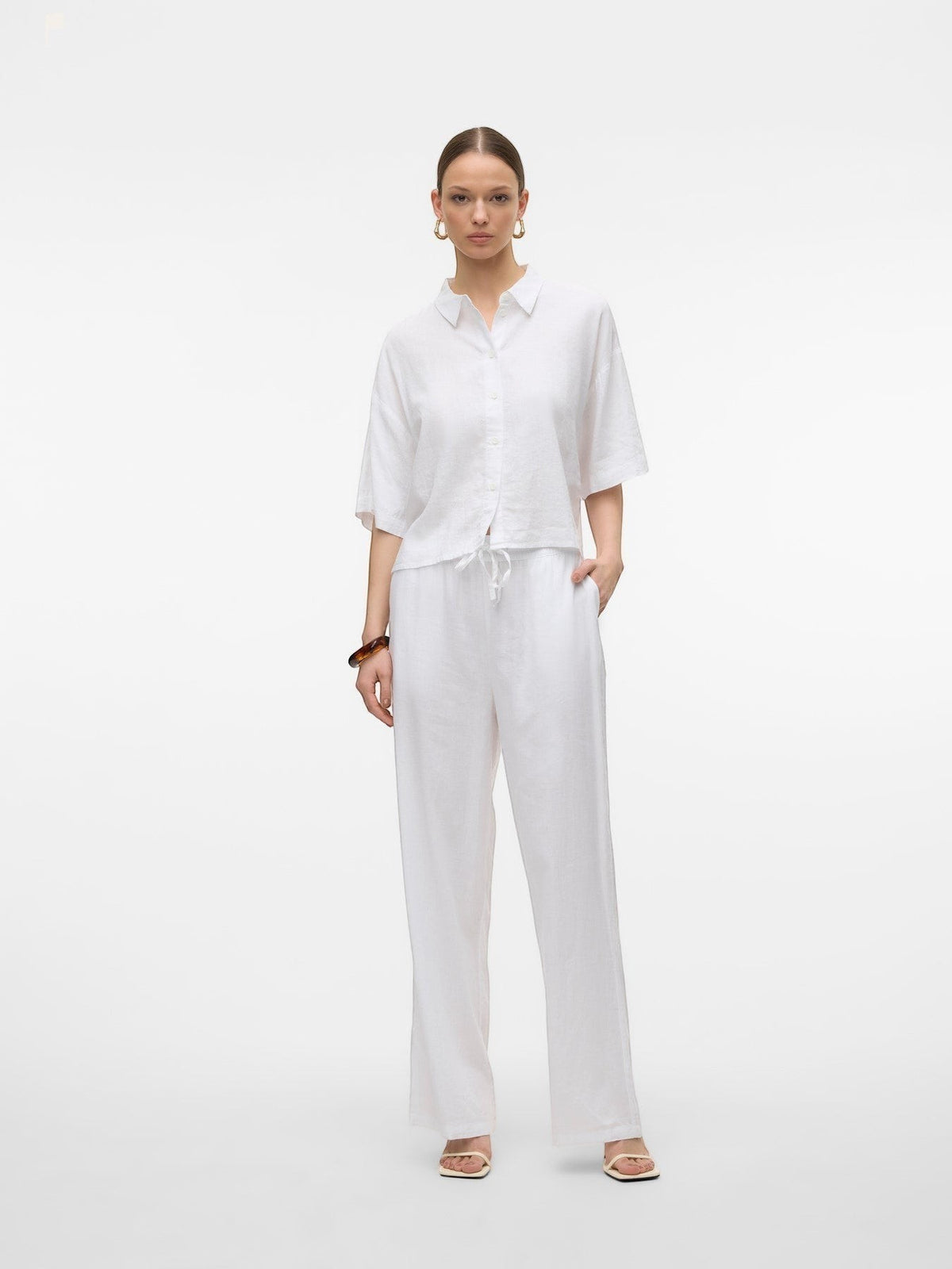 Antique Rose Boutique Vero Moda white linen wide-leg trousers with drawstring waist worn by a model with a matching shirt